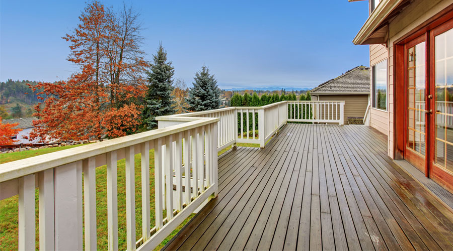 Finished outdoor wood deck with railing and clean installation