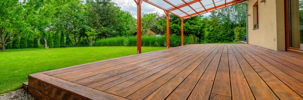Clean stained wood deck prepared for summer outdoor use and seasonal deck maintenance